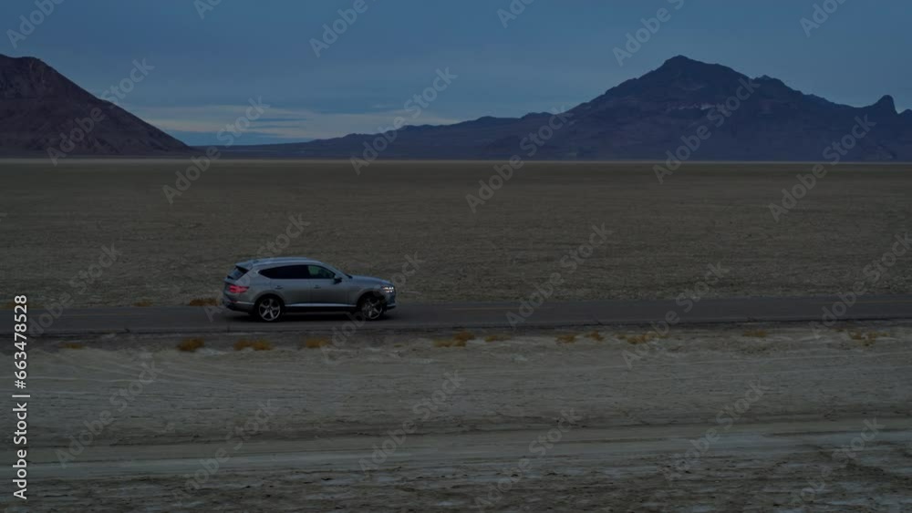 Beautiful Drone Shot Speedy Down Desert Highway With Van - Dusk Beautiful Drone Shot Speedy Down Desert Highway With Van - Dusk
