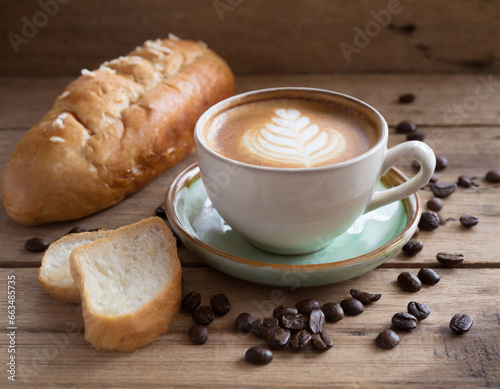 Coffee with bread on wooden table