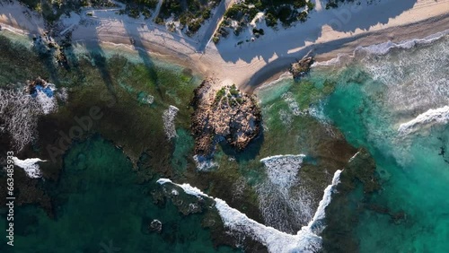 Aerial view of Mettams Pool Beach with a residential district along the coastline in Perth, Western Australia, Australia. photo