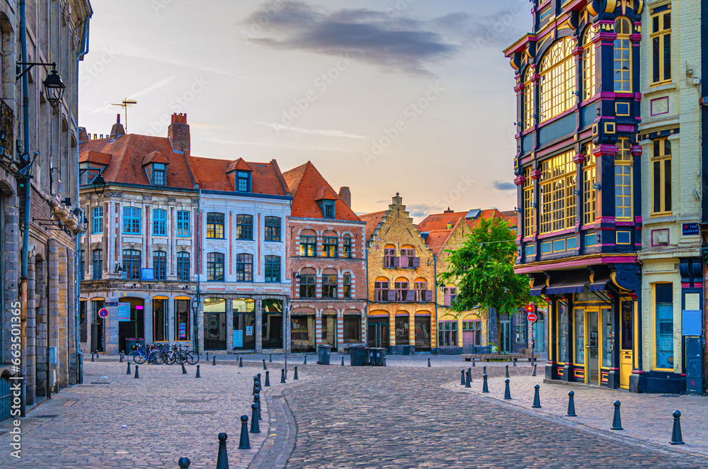 Obraz na płótnie Vieux Lille old town quarter with empty narrow cobblestone street, paving stone square with old colorful buildings in historical city centre, French Flanders, Hauts-de-France Region, Northern France w salonie
