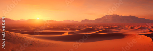 The Sun Rises Over the Desert Sand Dunes