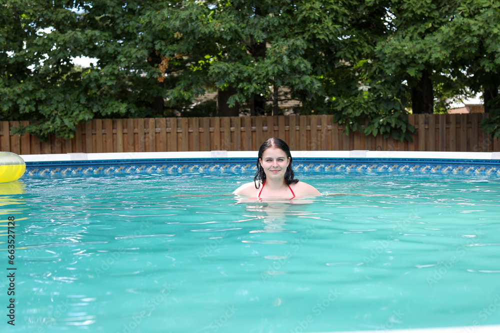 Woman Swimming in pool. Woman Swimming in pool.