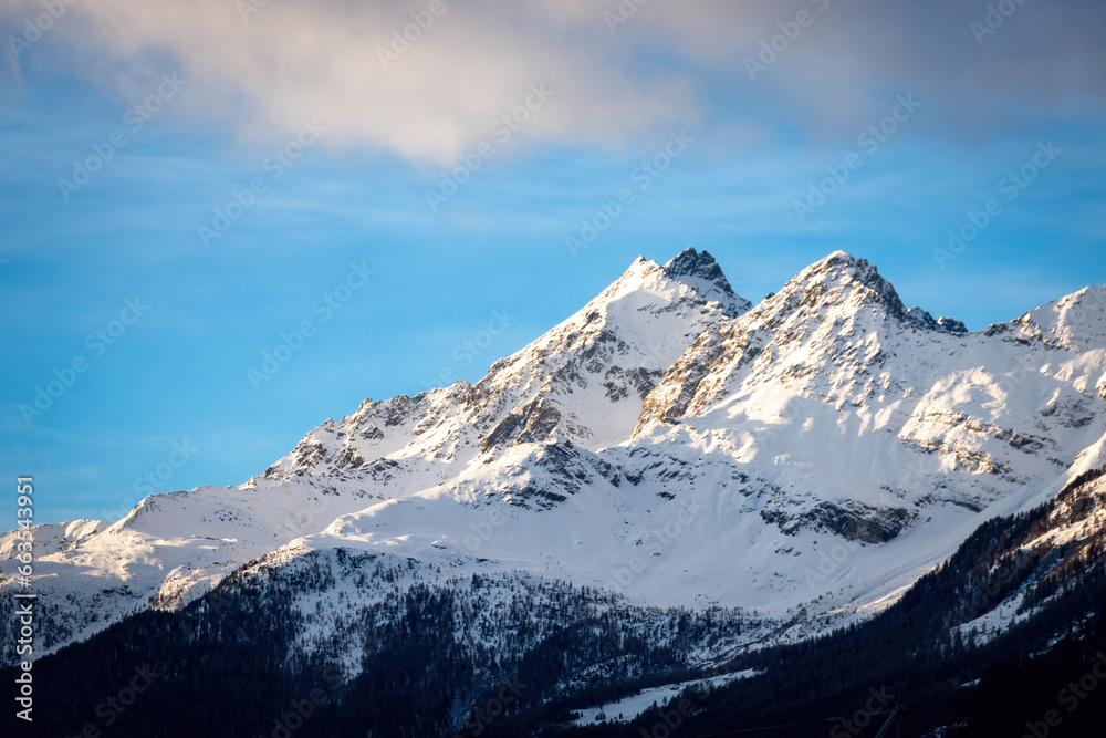 Scenic view of Cima Redasco (left), Monte Zandila (right) seen from Bormio, Italy in winter