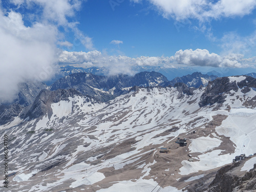 Beautiful landscape with Alpine mountains. Alps are highest and most extensive mountain range system that lies in Europe. Snowy peaks in Bavaria. View from the observation deck at the top of Zugspitze