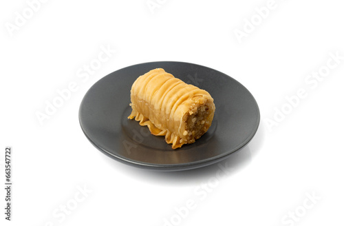 Rolled Baklava Isolated, Ramadan Dessert Roll on Restaurant Plate, Eastern Sweet Pastries photo