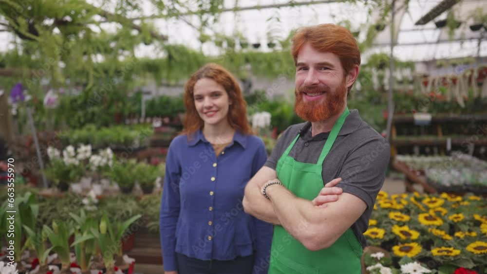 Joyful Female Customer and Confident Male Florist in Green Apron at Flower Shop Joyful Female Customer and Confident Male Florist in Green Apron at Flower Shop
