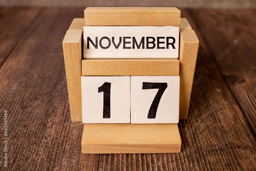 Wood blocks in box with date, day and month 17 November. Wooden blocks calendar Wood blocks in box with date, day and month 17 November. Wooden blocks calendar