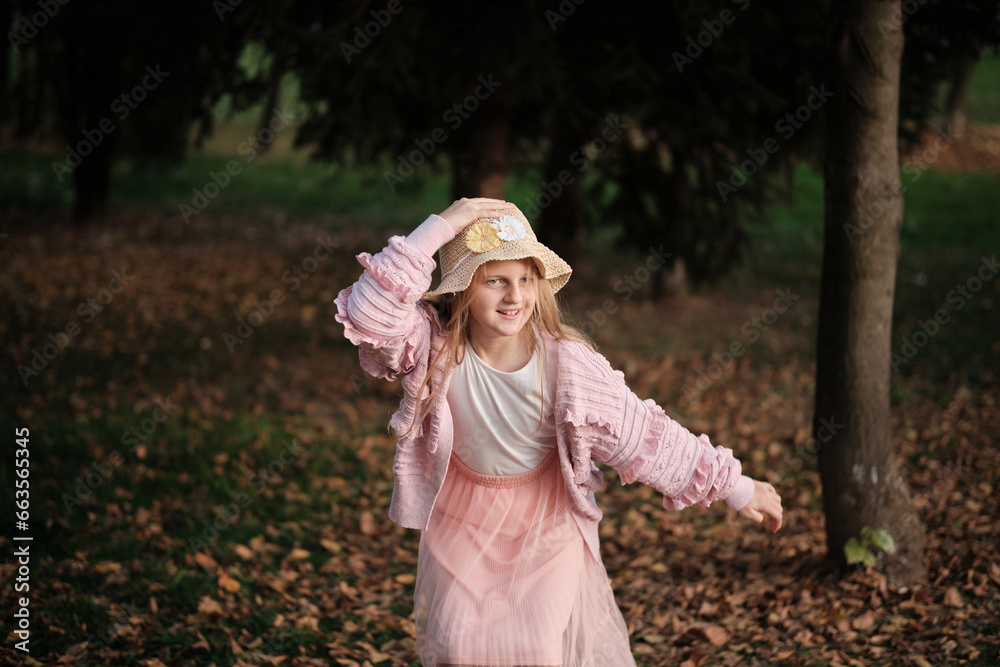 A happy joyful girl in the autumn park.