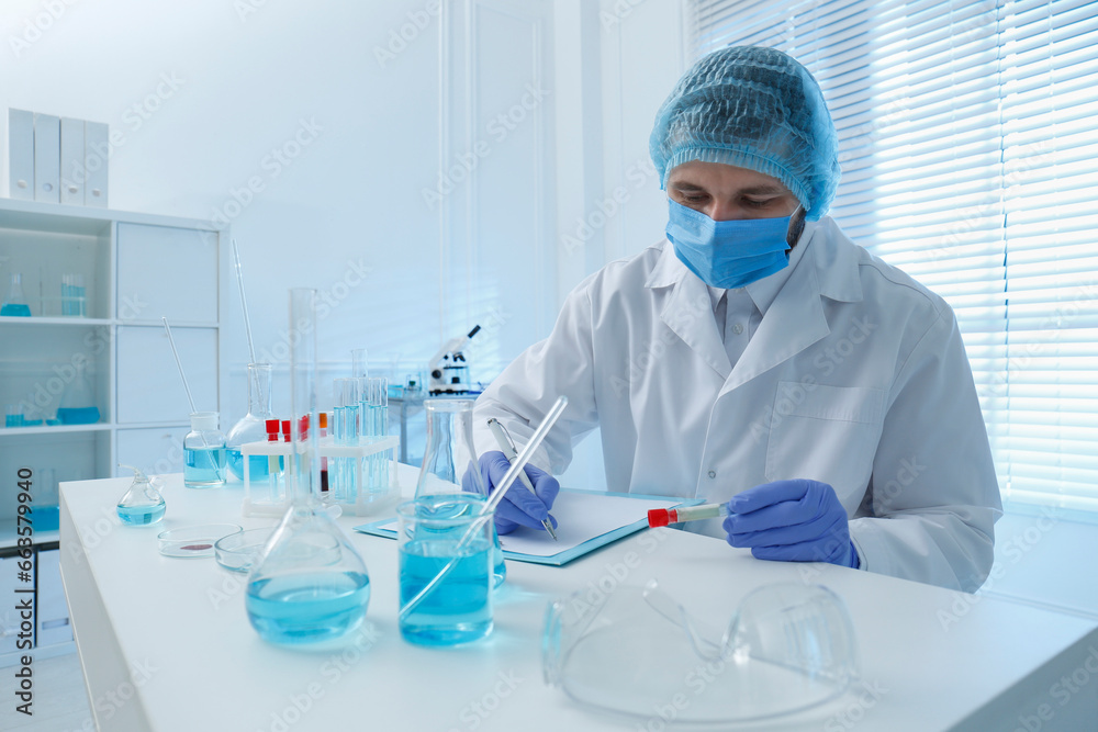 Scientist working at table in laboratory. Medical research Scientist working at table in laboratory. Medical research