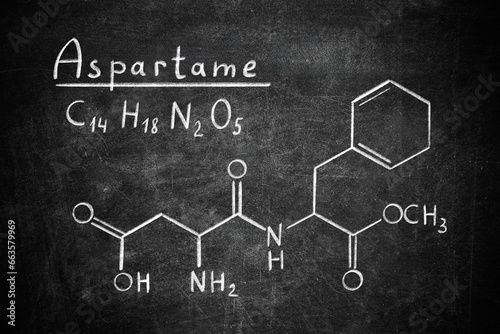 Formula of aspartame (chemical and structural) written on blackboard. Sugar substitute photo