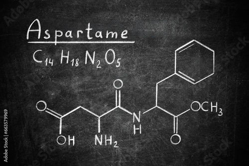 Photos Formula of aspartame (chemical and structural) written on blackboard