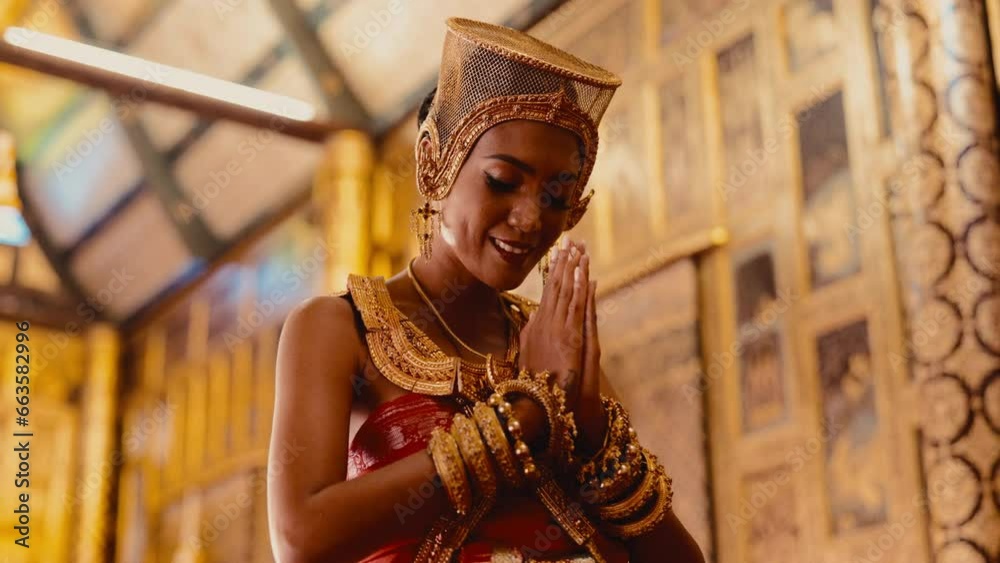 A Lady Wearing Chut Thai Praying Happily