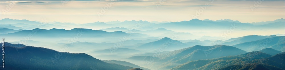 A majestic mountain range engulfed in mystical fog