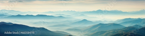 A majestic mountain range engulfed in mystical fog