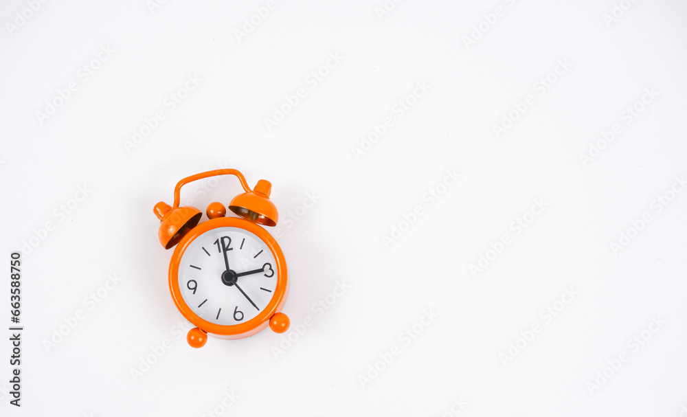 A orange clock isolated with white background. A orange clock isolated with white background.