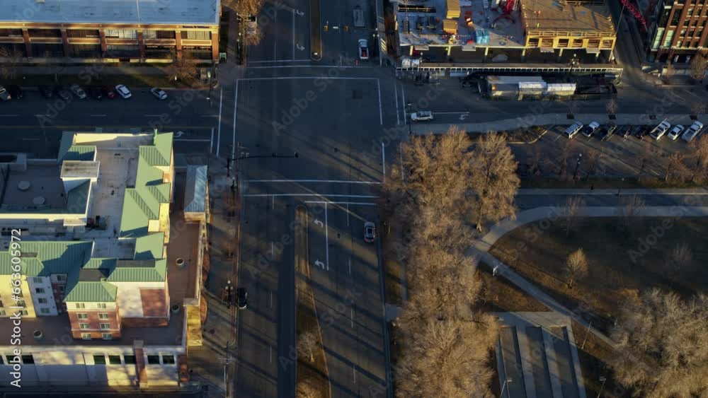 Beautiful high drone shot looking down at city street and buildings at sunrise Beautiful high drone shot looking down at city street and buildings at sunrise