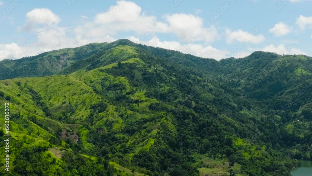 Aerial view of mountains and hills with green vegetation and trees in the tropics. Negros, Philippines Aerial view of mountains and hills with green vegetation and trees in the tropics. Negros, Philippines