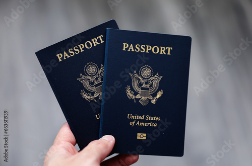 U.S. passport on a dark background, symbolizing travel, identity, citizenship, and international journeys, with patriotic colors and security features