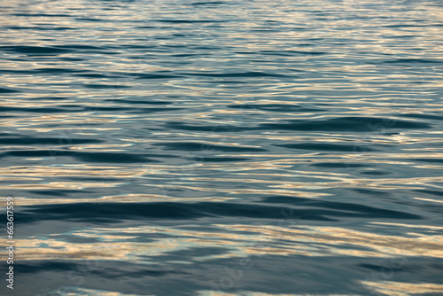 Blue sea with clear water. Ocean deep indigo in daylight. Feeling calm and relaxing. The idea for ocean background and copy space.