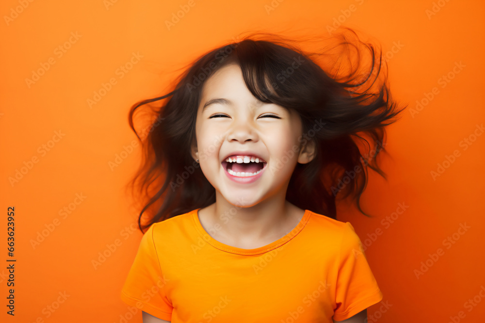Happy asian children laughing/smiling, orange background, warm color background,chinese girl,Korean girl,japanese girl,Children's Day Happy asian children laughing/smiling, orange background, warm color background,chinese girl,Korean girl,japanese girl,Children's Day