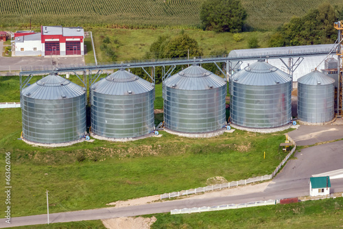 aerial panoramic view on agro-industrial complex with silos and grain drying line