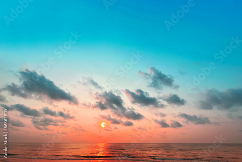 Sunrise horizon cool sea background on horizon tropical sandy beach; relaxing outdoors vacation	