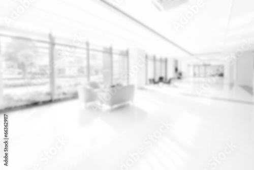 Blur background with glass door inside building gray tone. interior lobby room at sofa in hotel.