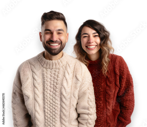 young couple wearing matching Christmas-themed sweaters, smile at the camera. isolated on transparent background. 