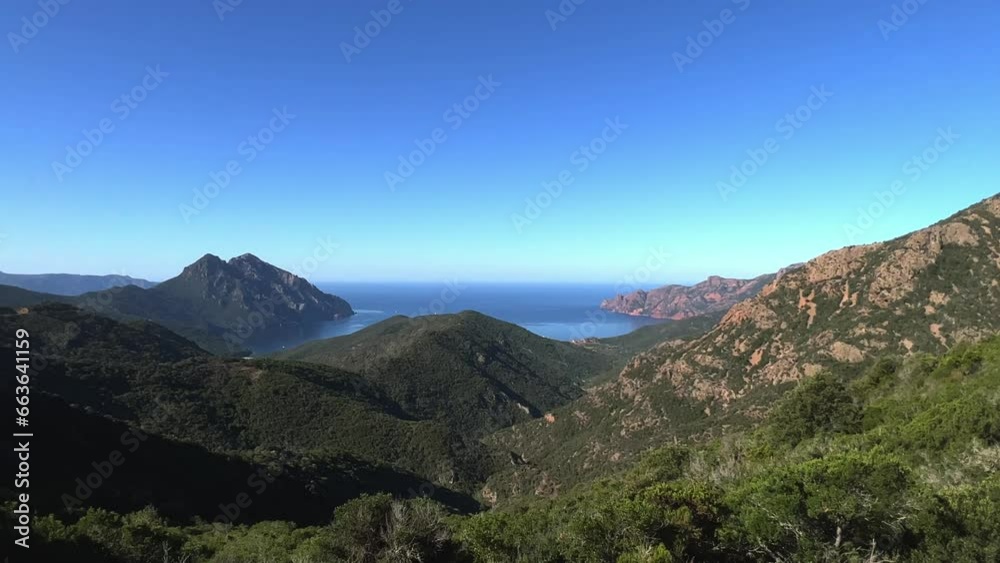 Panoramic view of Scandola UNESCO nature reserve in summer season, Corsica island in France. Zoom in Panoramic view of Scandola UNESCO nature reserve in summer season, Corsica island in France. Zoom in