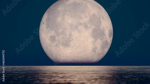 The moon rising over the sea during the Mid-Autumn Festival on August 15th