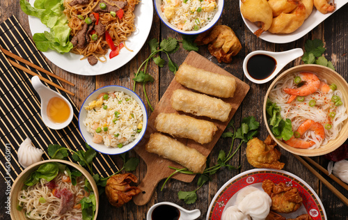 assorted of asian food- stir fry noodles, spring roll, soup, shrimp
