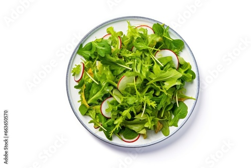 Healthy fresh green salad plate shot from above on white background.