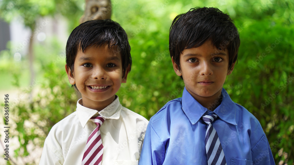 Cheerful Happy smiling village school kids in uniform standing. Concept of friendship, education and togetherness Cheerful Happy smiling village school kids in uniform standing. Concept of friendship, education and togetherness