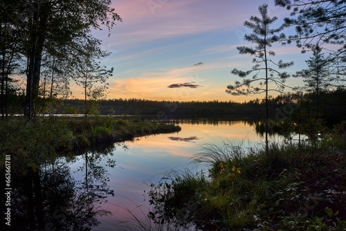 Scenic view of a tranquil lake at sunset