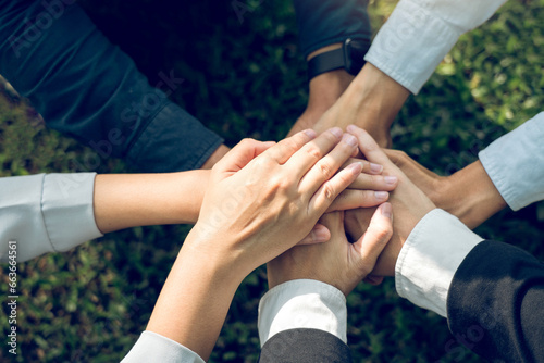 Group of volunteer people joining for cooperation about global community teamwork with join hand together, World environment day, sustainable development goal.