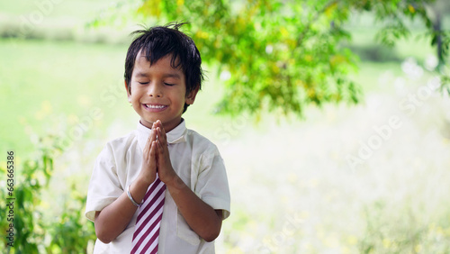 Portrait of Indian School Boy Praying in school ground