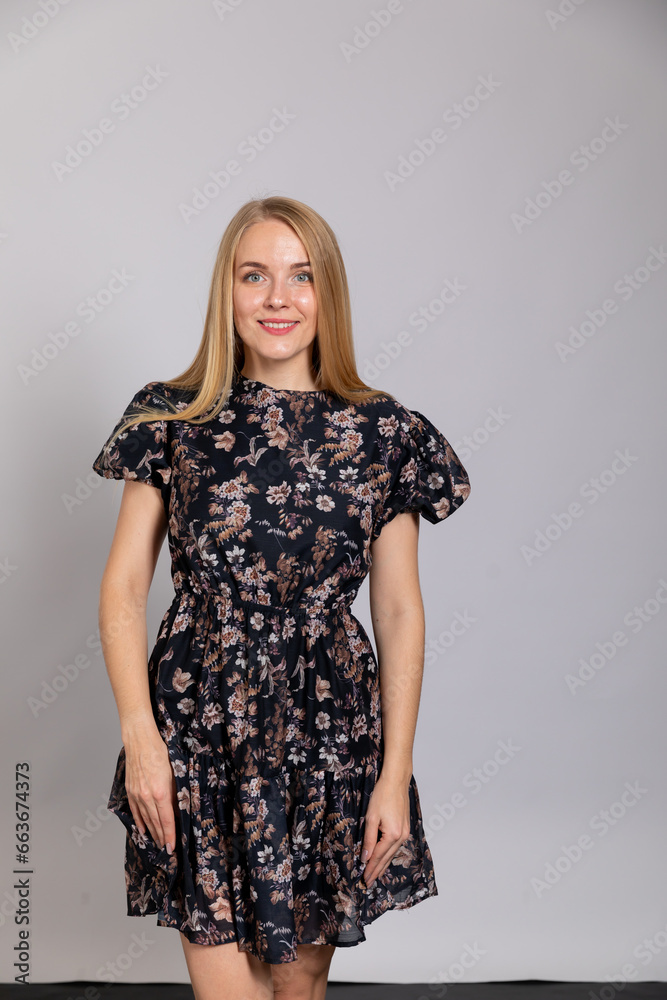 Beautiful blonde woman posing on light background Beautiful blonde woman posing on light background