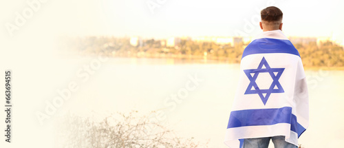 Man with the flag of Israel outdoors. Banner for design