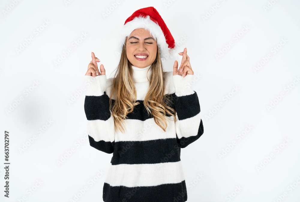 Young beautiful woman has big hope, crosses fingers, believes in good fortune, smiles broadly. People and wish concept Young beautiful woman has big hope, crosses fingers, believes in good fortune, smiles broadly. People and wish concept