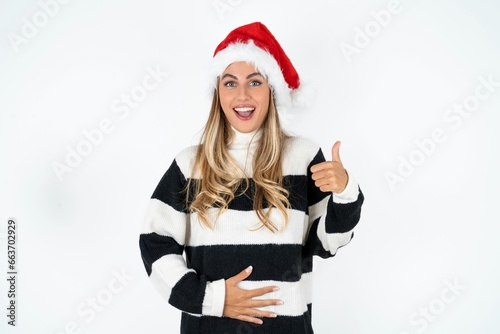 Young beautiful woman happy positive smile hands on belly show thumb-up fine healthy