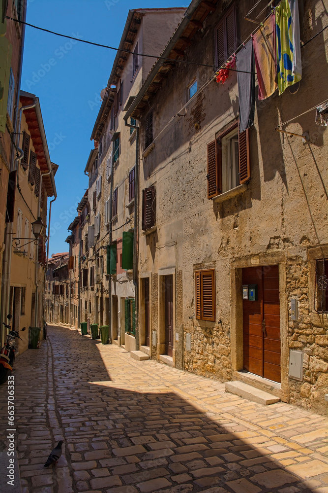 Fototapeta premium A quiet back street in the historic centre of the medieval coastal town of Rovinj in Istria, Croatia