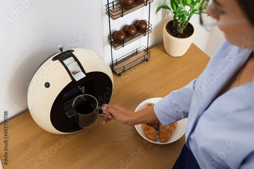 Woman pouring freshly brewe...