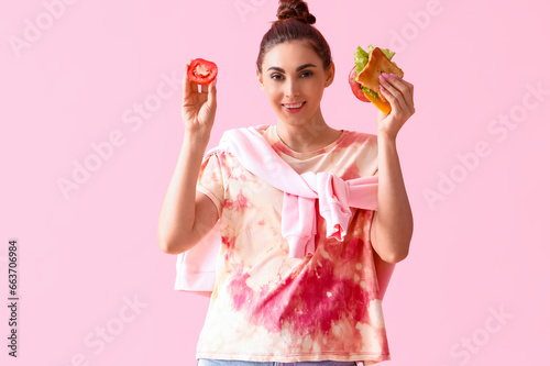 Young woman with tasty sand...