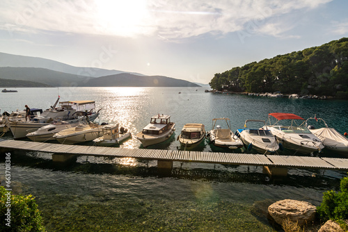 Motorboats at the jetty in picturesque bay (Osor) on the island of Losinj in the Adriatic Sea, Croatia