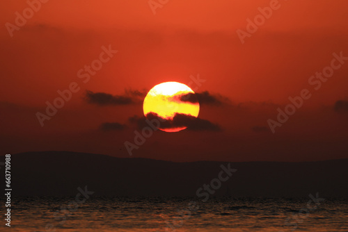 Sun at sunset  warm colors  view from the beach on Island Murter  Adriatic sea  Croatia
