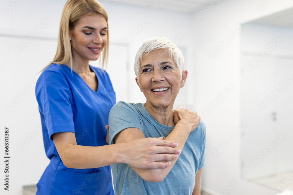 Doctor or Physiotherapist working examining treating injured arm of senior patient, stretching and exercise, Doing the Rehabilitation therapy pain in clinic. Doctor or Physiotherapist working examining treating injured arm of senior patient, stretching and exercise, Doing the Rehabilitation therapy pain in clinic.