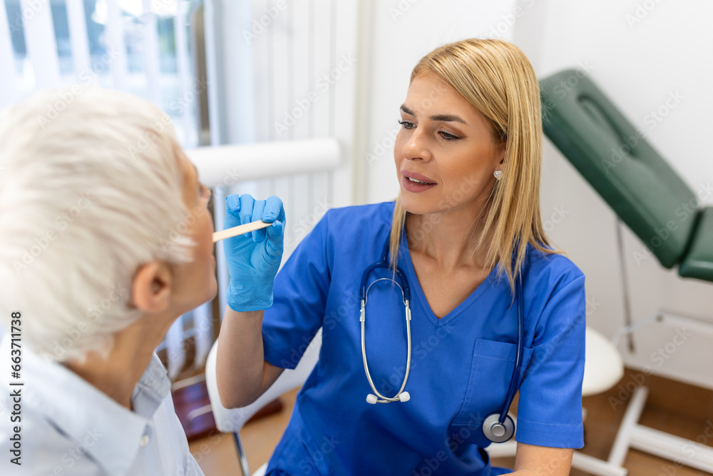 senior-patient-opening-her-mouth-for-the-doctor-to-look-in-her-throat