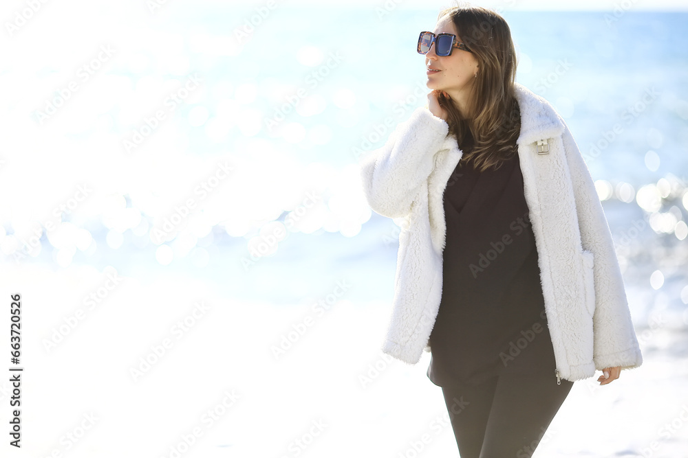 Fototapeta premium girl in sunglasses beach winter cold vacation freedom mediterranean sea
