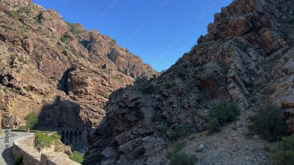 Driving POV along dangerous panoramic road of Ruda canyon with rocky mountain landscape of central Corsica in France Driving POV along dangerous panoramic road of Ruda canyon with rocky mountain landscape of central Corsica in France