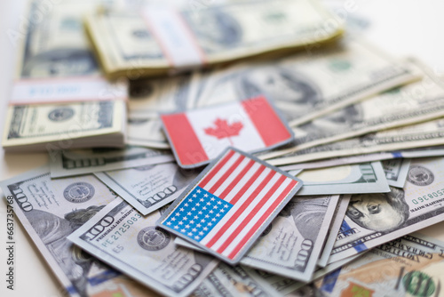 us and canadian flag on a us dollar background